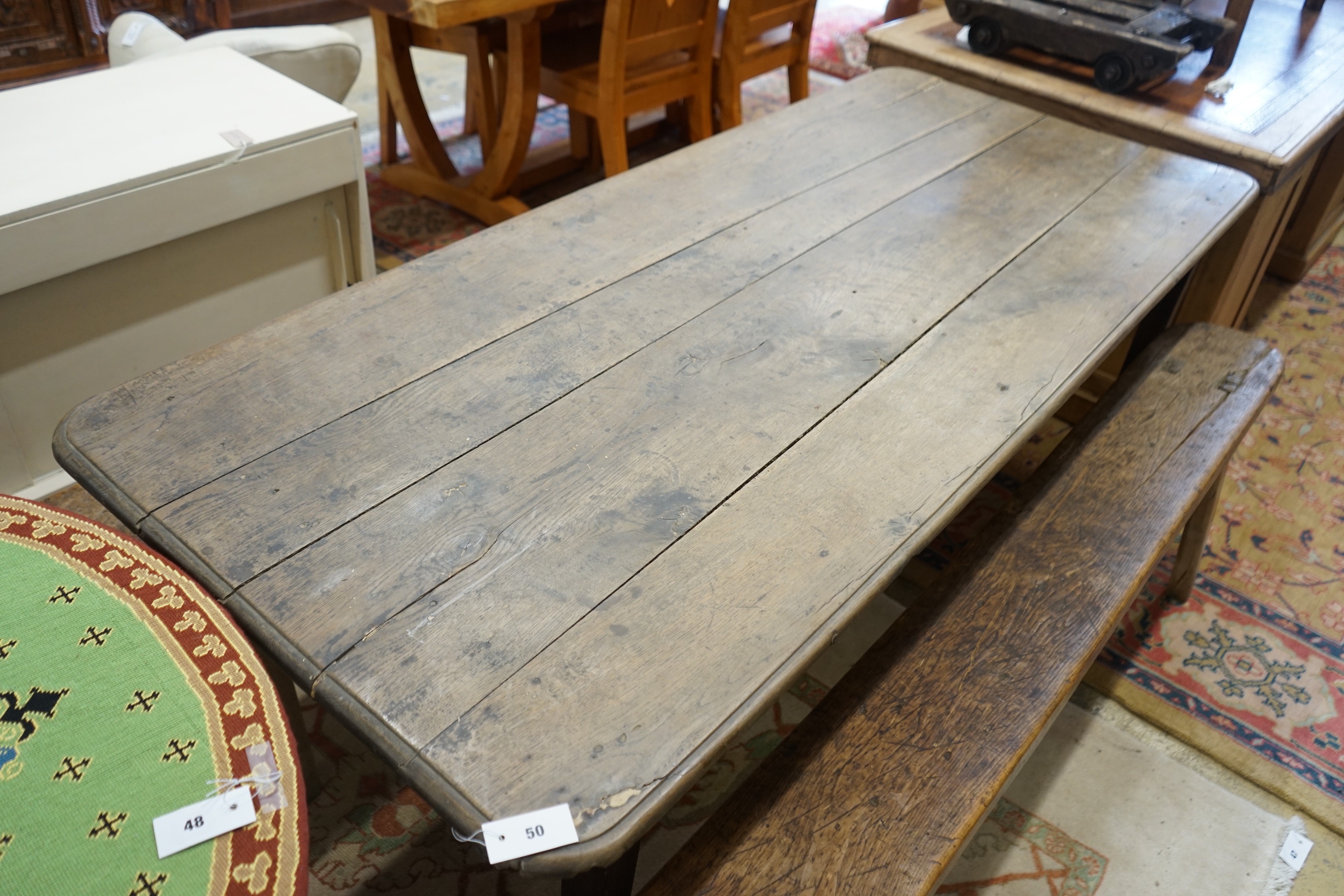 A 19th century rectangular oak kitchen table on square tapered legs, length 196cm, depth 84cm, height 74cm